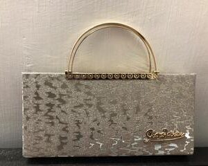 sculptural rose gold texture clutch with modern d ring handle