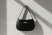 minimalist half moon shoulder bag with gold hardware